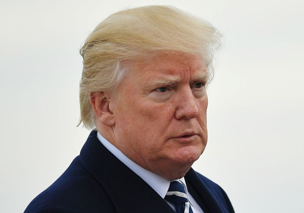 US President Donald Trump makes his way to board Air Force One before departing from John F. Kennedy International Airport in New York, New York on December 2, 2017. AFP / MANDEL NGAN