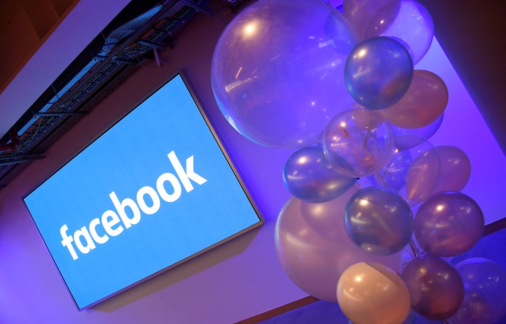 Balloons are seen in front of a logo at Facebook's headquarters in London, Britain, December 4, 2017. REUTERS/Toby Melville
