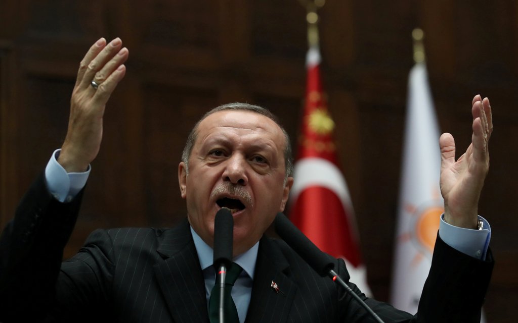 Turkey's President Tayyip Erdogan addresses members of parliament from his ruling AK Party (AKP) during a meeting at the Turkish parliament in Ankara, Turkey, December 5, 2017. REUTERS/Umit Bektas