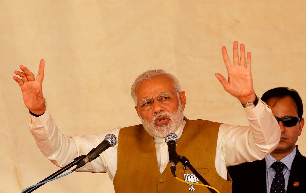 India's Prime Minister Narendra Modi addresses his supporters during a campaign meeting ahead of Gujarat state assembly election in Kalol on the outskirts of Ahmedabad, India, December 8, 2017. REUTERS/Amit Dave