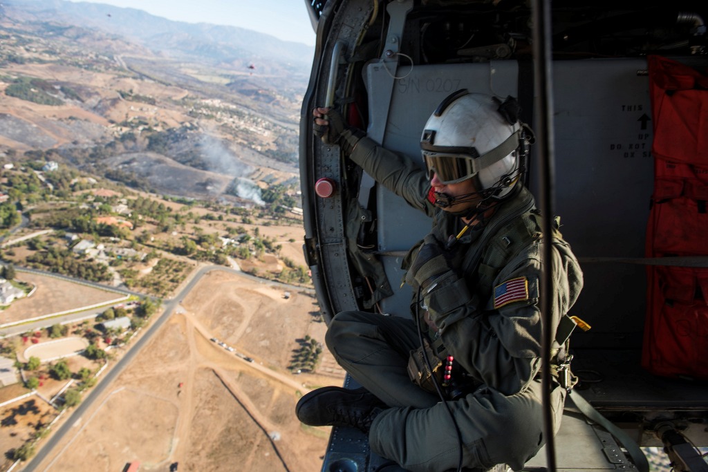 US Navy shows Naval Aircrewman (Helicopter) 1st Class Justin Greene assigned to the 