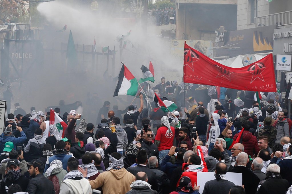 Protesters are sprayed with water near the U.S. embassy in Awkar east of Beirut, Lebanon December 10,2017. REUTERS/Mohamed Azakir.
