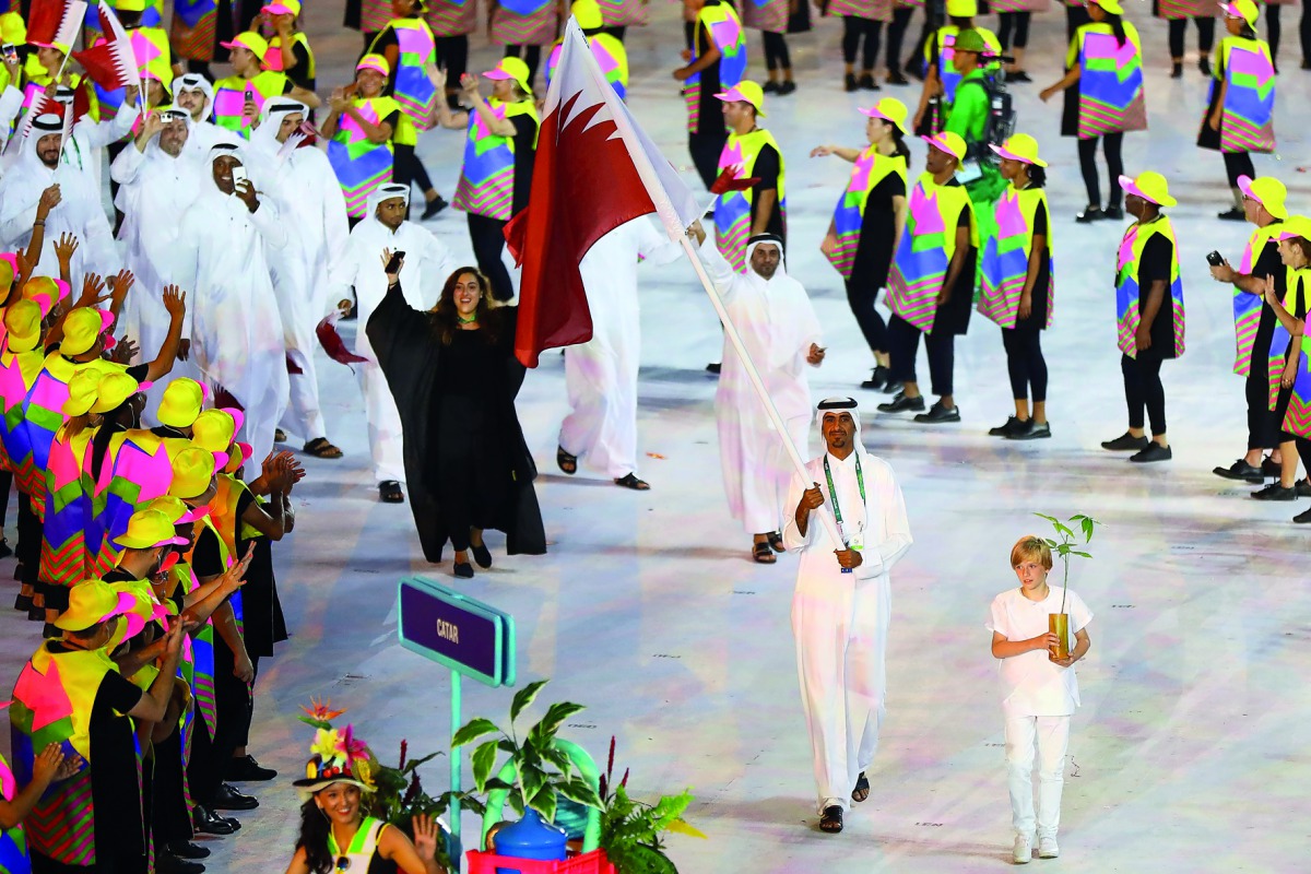 Sheikh Ali Khalid Al Thani, flagbearer of Qatar at the Rio Olympics, leads his contingent during the opening ceremony at the Maracana Stadium in Rio de Janeiro in this August 5, 2016 file photo.