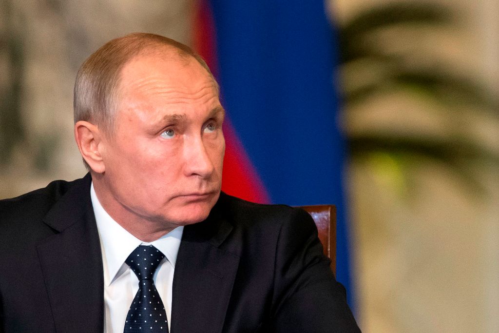 Russian President Vladimir Putin looks on during a press conference with his Egyptian counterpart (unseen) following their talks at the presidential palace in the capital Cairo on December 11, 2017.   AFP / POOL / Alexander Zemlianichenko
