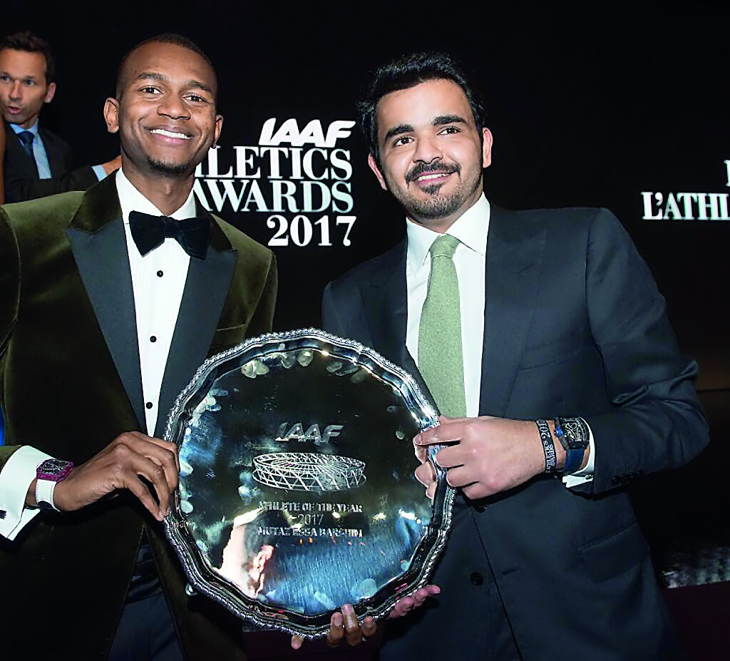 Qatar Olympic Committee President H E Sheikh Joaan bin Hamad Al Thani poses for a photograph with champion high jumper Mutaz Essa Barshim after the latter won the ‘World Athlete of the Year 2017’ trophy at the IAAF Awards in Monaco in this November 24 fil