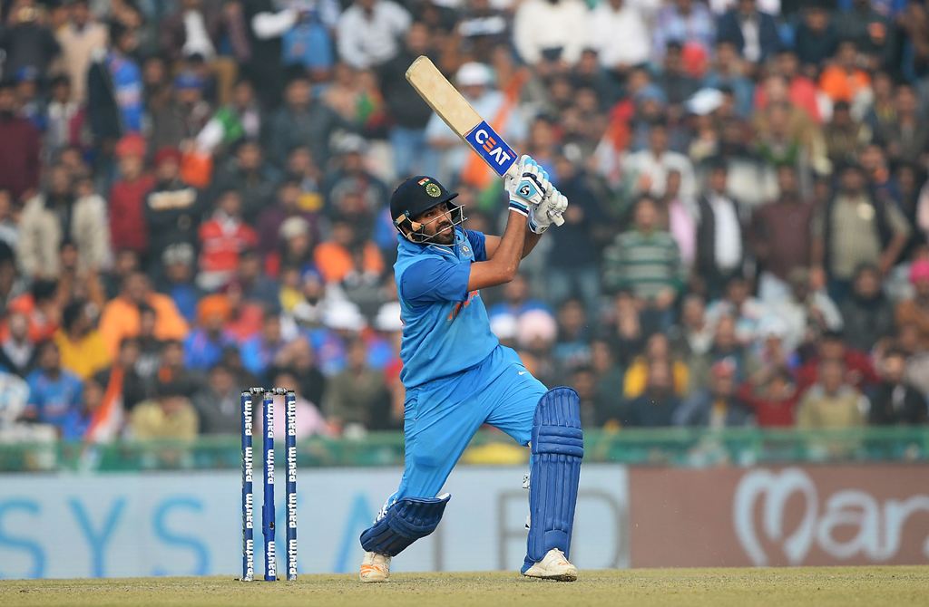 Indian cricket batsman and team captain Rohit Sharma plays a shot during the second One Day International (ODI) cricket match between India and Sri Lanka at The Punjab Cricket Association Stadium in Mohali on December 13, 2017. (AFP / SAJJAD HUSSAIN )
