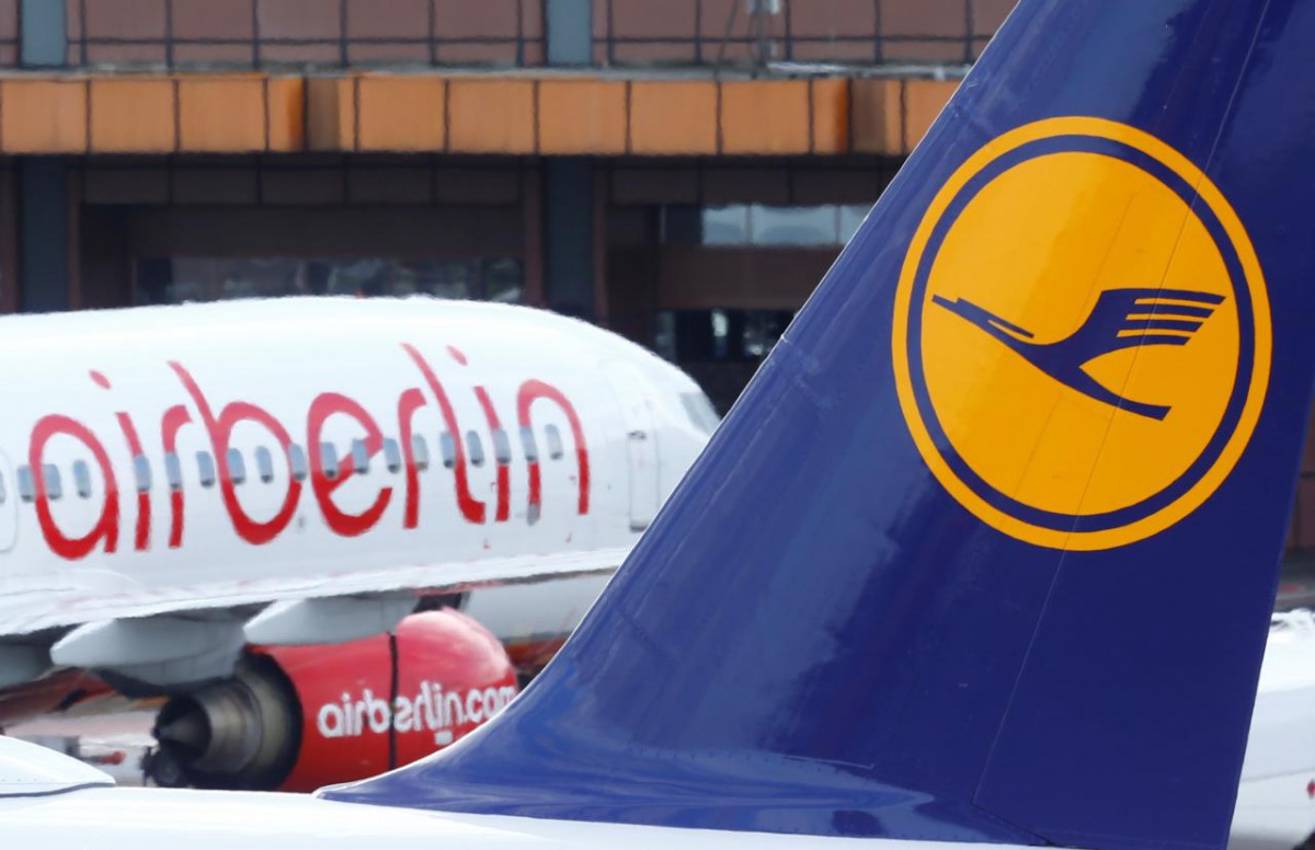 FILE: A Lufthansa airliner parks next to the Air Berlin aircraft at Tegel airport in Berlin, Germany, October 12, 2017. REUTERS/Hannibal Hanschke