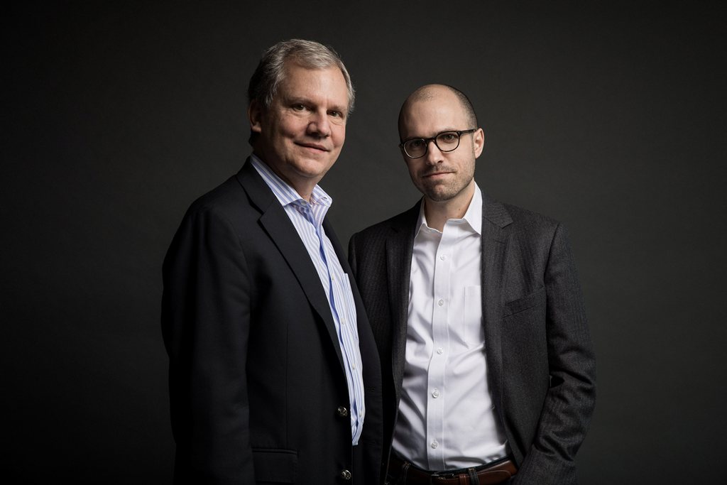 The incoming publisher of the New York Times Arthur Gregg (A.G.) Sulzberger and his father Arthur Ochs Sulzberger Jr. (L) pose for pictures on the 16th floor of the New York Times building in New York, U.S. on December 12, 2017. (Damon Winter/The New York
