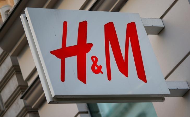 The logo of Swedish fashion lebel H&M is seen outside a store in Vienna, Austria. REUTERS/Leonhard Foeger/ File photo
