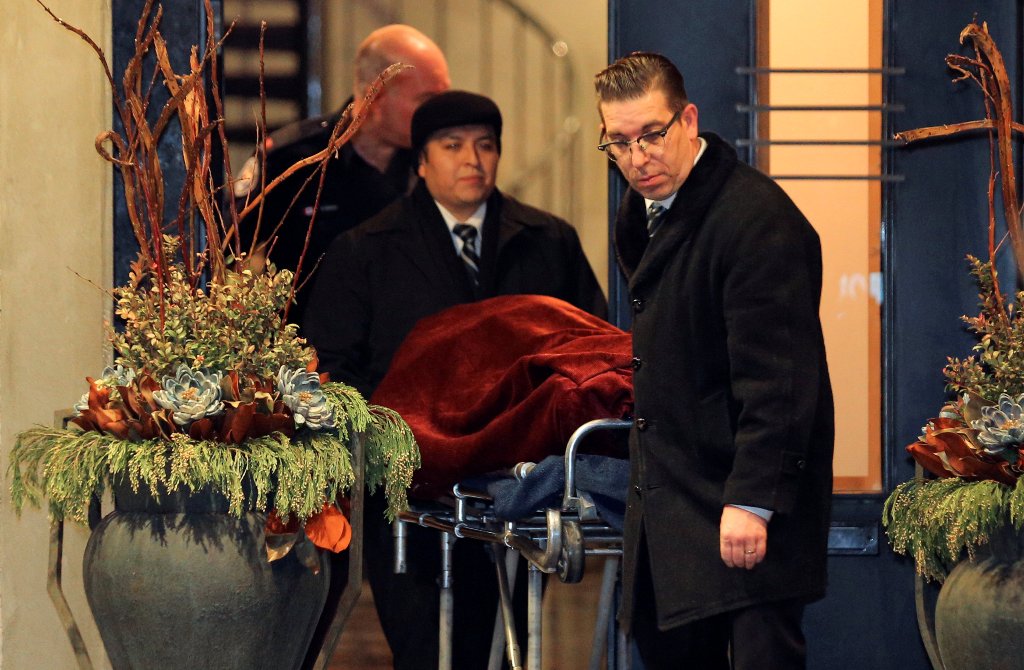One of two bodies is removed from the home of billionaire founder of Canadian pharmaceutical firm Apotex Inc., Barry Sherman and his wife Honey, who were found dead under circumstances that police described as 