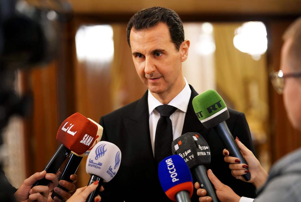 A handout picture released by the Syrian Arab News Agency (SANA) on December 18, 2017 shows Syrian President Bashar al-Assad speaking to the press after receiving a Russian delegation in Damascus. AFP PHOTO / HO / SANA