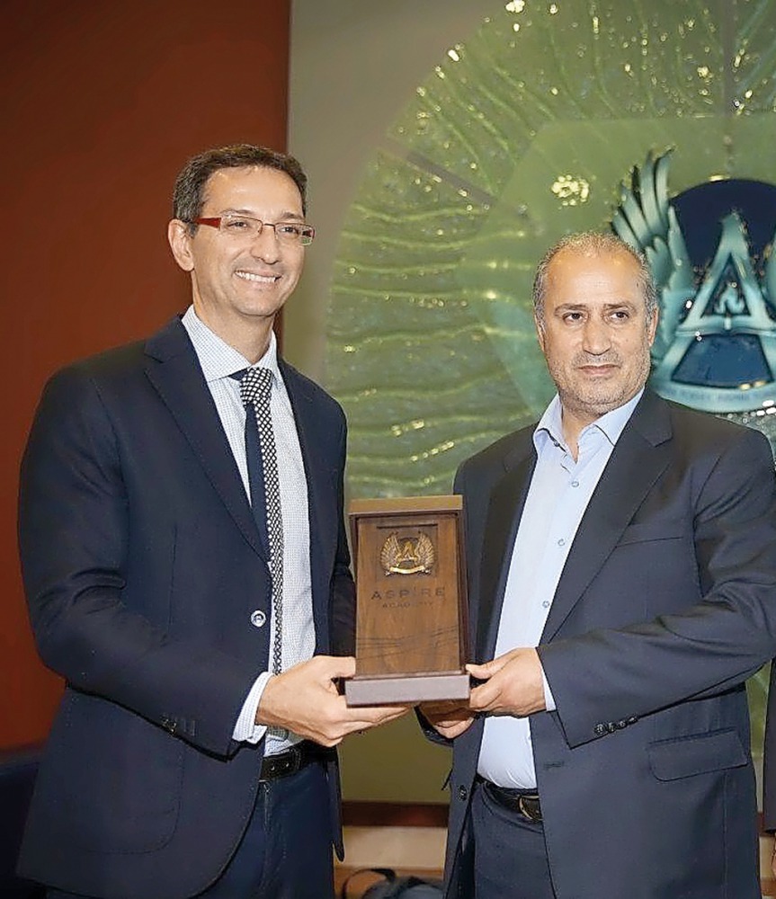 Aspire Academy’s Director General, Ivan Bravo (left) presents a memento to Football Federation of Islamic Republic of Iran (FFIRI) President Mehdi Taj.