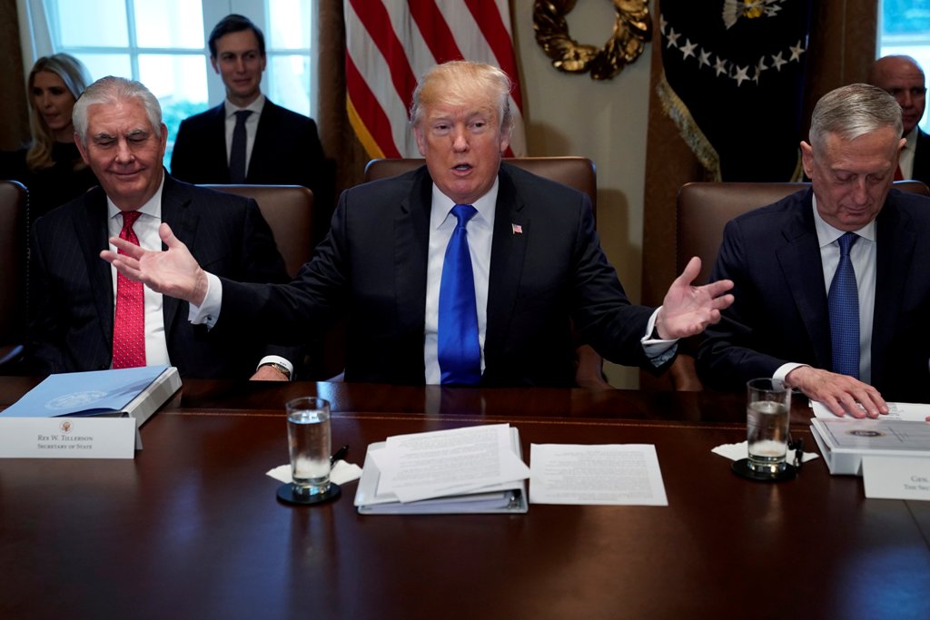 U.S. President Donald Trump, flanked by Secretary of State Rex Tillerson and Defense Secretary James Mattis, holds a cabinet meeting at the White House in Washington, U.S., December 20, 2017. REUTERS/Jonathan Ernst