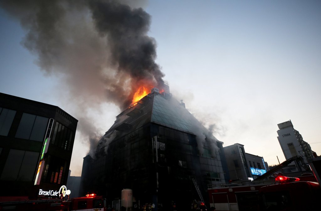 Smoke rises from a burning building in Jecheon, South Korea, December 21, 2017. Yonhap via REUTERS.