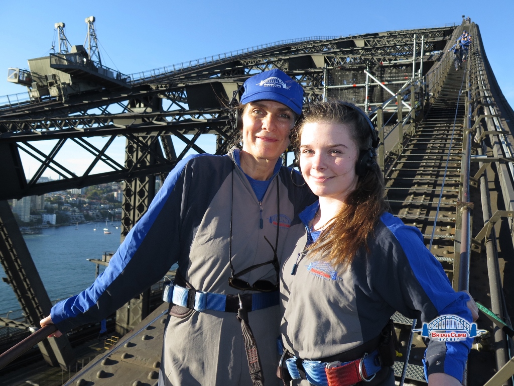 Brigid Schulte, left, and her daughter, Tessa Bowman, near the top of the Sydney Harbor Bridge, the tallest steel-arch bridge in the world. Bridge Climb photo

