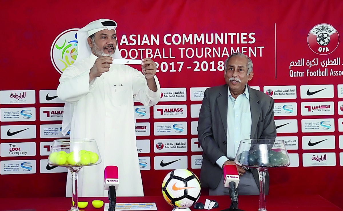 Qatar Football Association Sub-Leagues Committee member Khalid Al Rumaihi (left) picks a team during the draw ceremony.