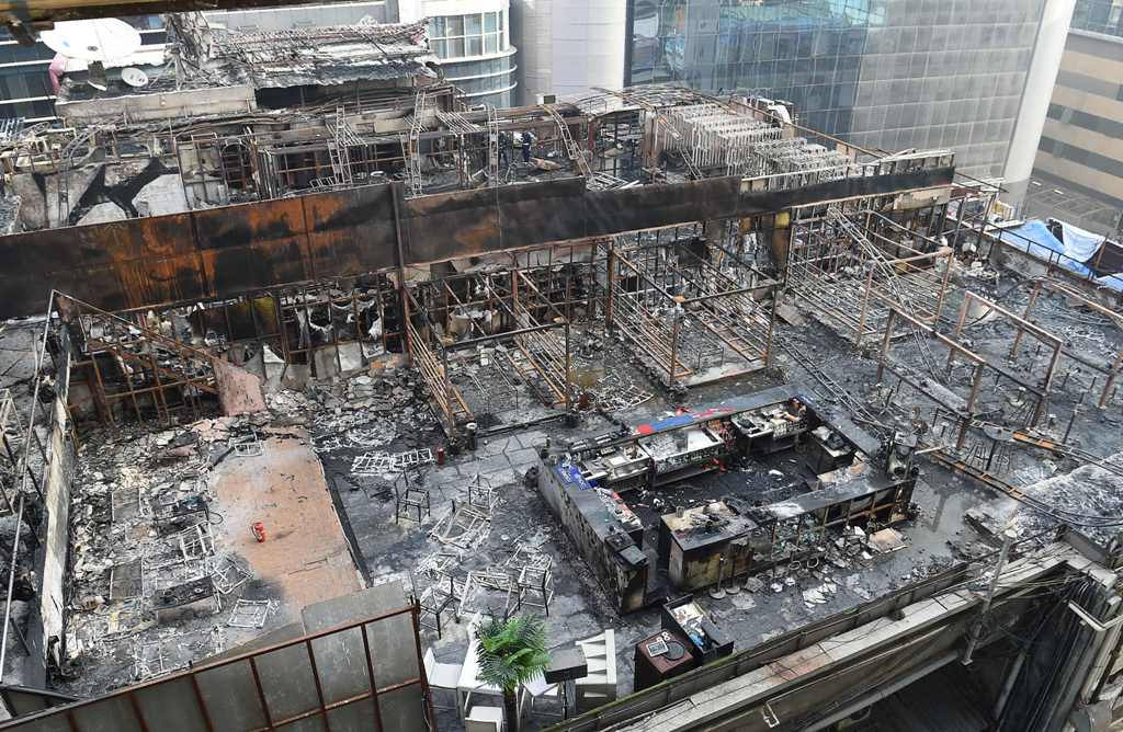 View of a burned building where a rooftop party was being held in Mumbai early on December 29, 2017. AFP / INDRANIL MUKHERJEE