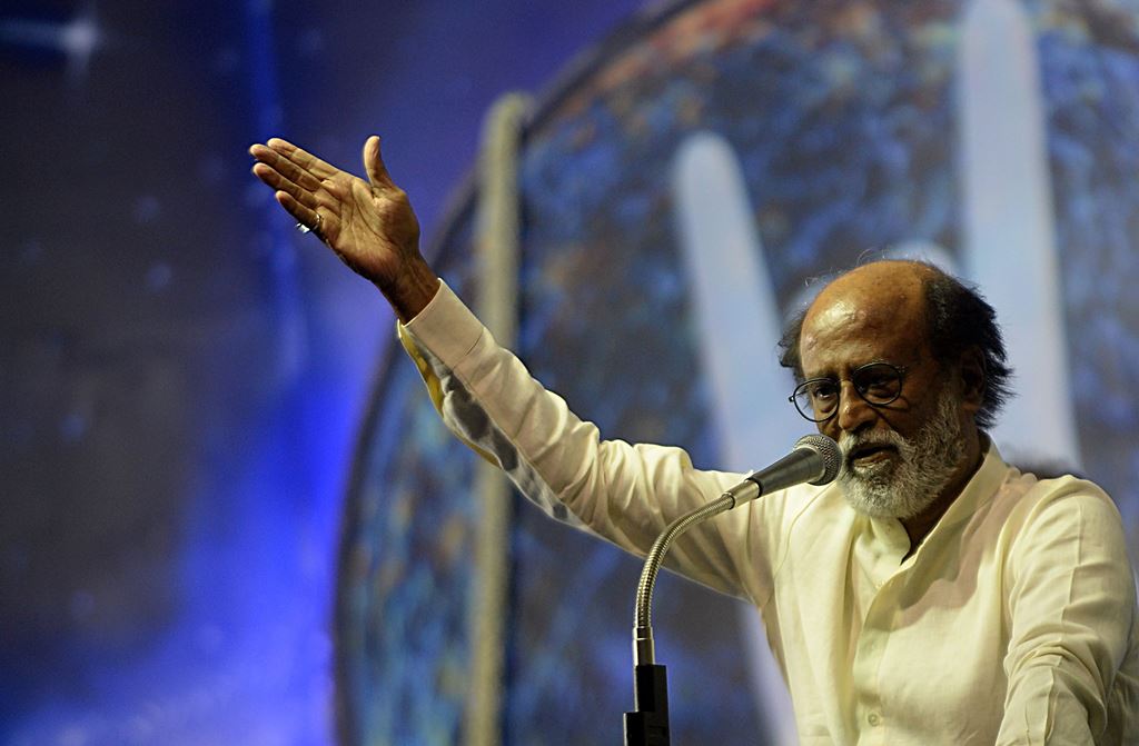(FILES) This file photo taken on December 29, 2017 shows Indian film actor Rajinikanth gesturing as he speaks during an interaction session with fans in Chennai. AFP / ARUN SANKAR
