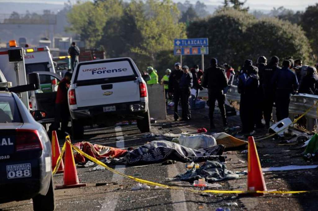 Picture shows dead bodies at an accident when a car crashed into a vehicle transporting pilgrims on the outskirts of Puebla, Mexico December 12, 2017. — Reuters pic.