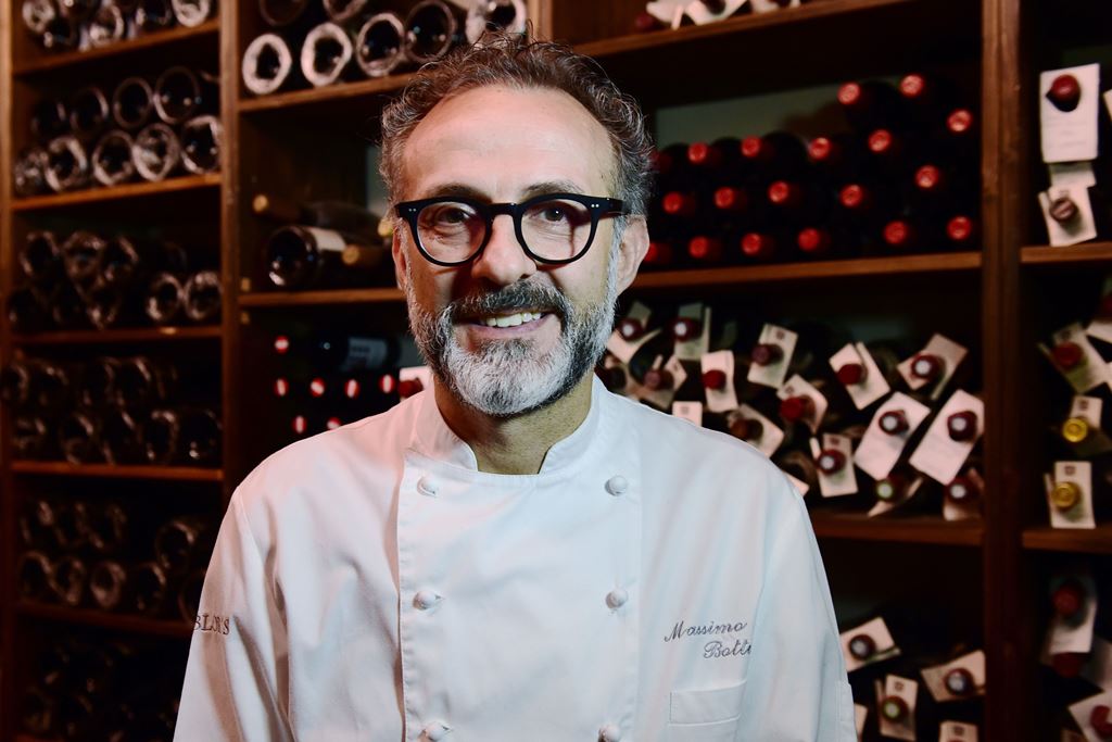 (FILES) This file photo taken on July 07, 2016 shows Italian chef Massimo Bottura posing in the kitchen of his restaurant 
