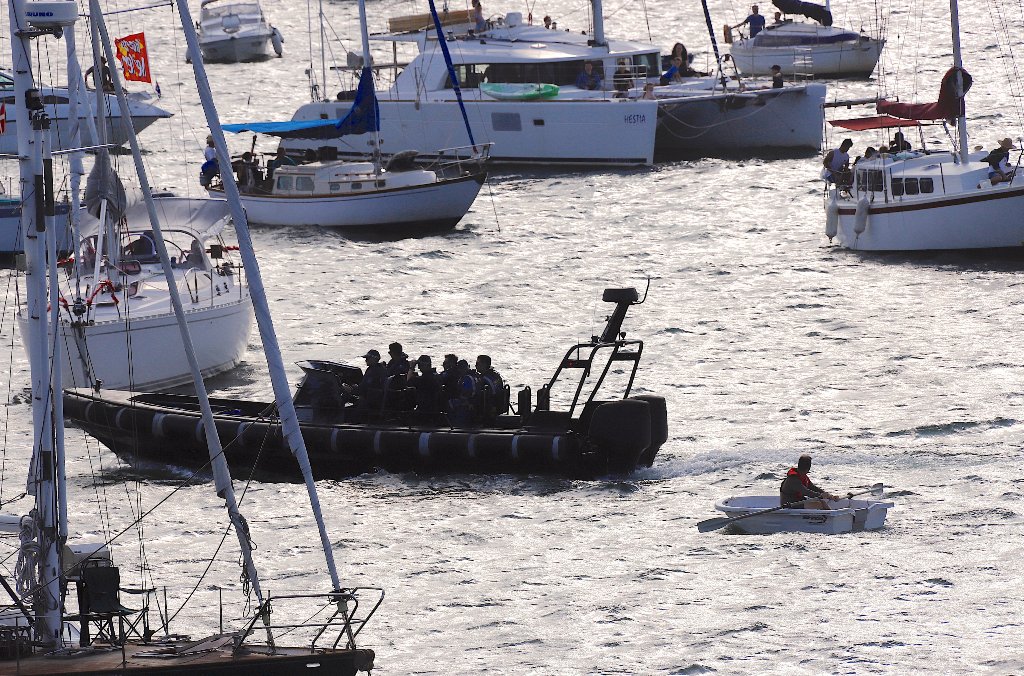 A police boat checks spectator craft as they wait for the annual new year fireworks as part of celebrations on Sydney Harbour, Australia, December 31, 2017. REUTERS/David Gray.