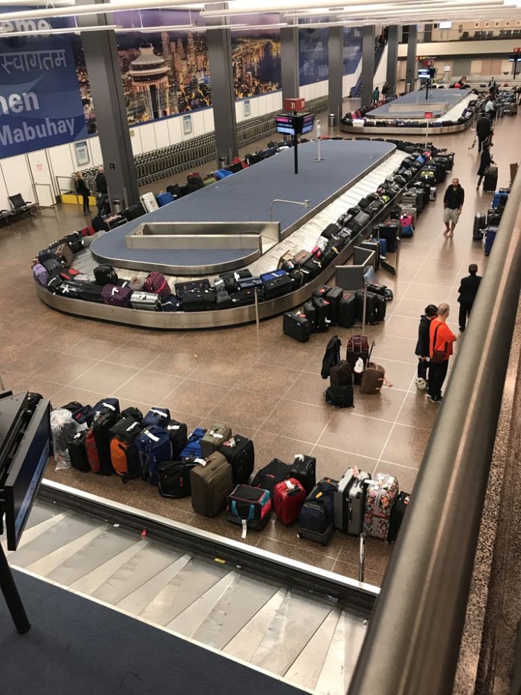 Luggages pile up at a carousel at a baggage claims area during a systems outage at Sea-Tac Airport in Seattle, Washington, U.S. in this January 1, 2018 picture obtained from social media. James Stout/via REUTERS 