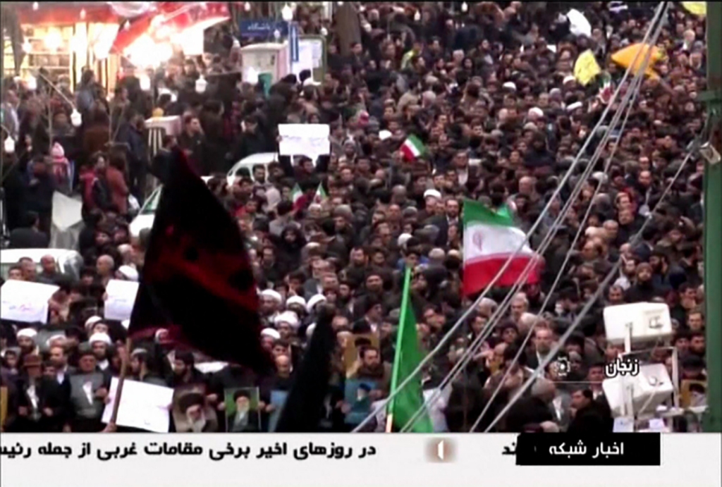 An image grab taken from a broadcast by Islamic Republic of Iran Broadcasting (IRIB) on January 1, 2018, shows Iranians chanting slogans as they march in support of the government in the northwestern city of Zanjan. AFP PHOTO / HO / IRIB