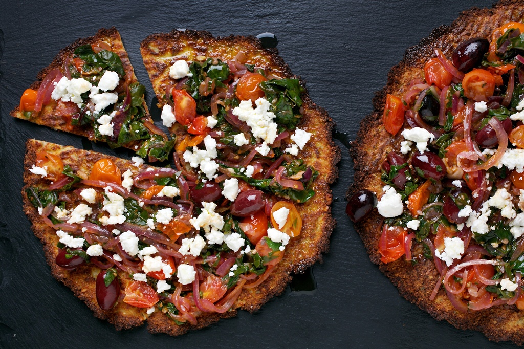 Cauliflower Pizzas With Chard and Olives. Photo by Deb Lindsey for The Washington Post.