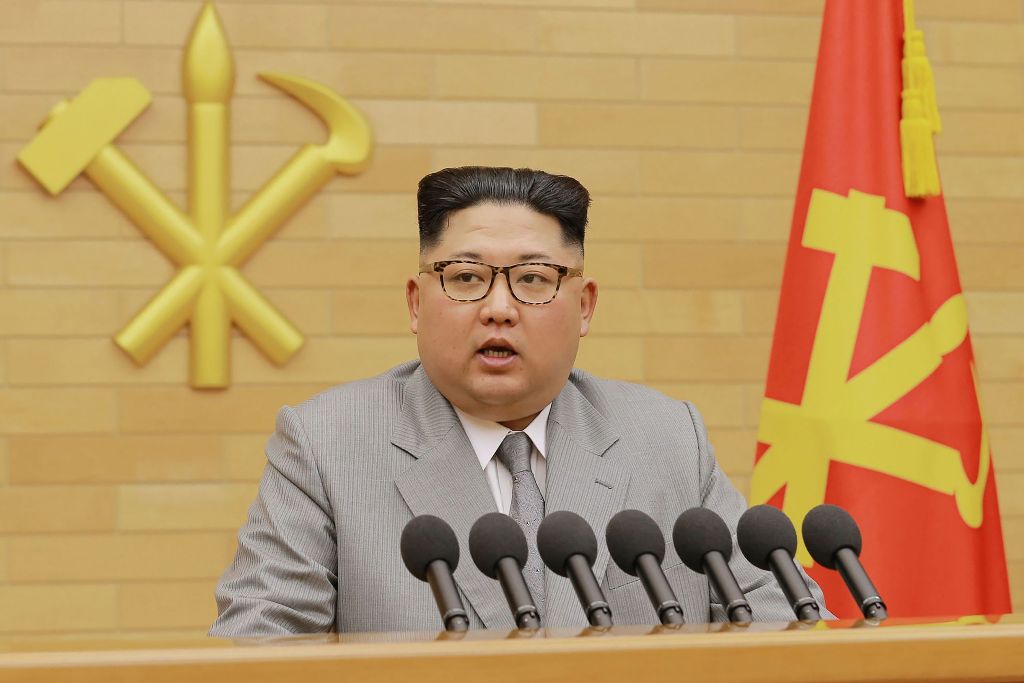 A picture North Korean leader Kim Jong-Un delivering a New Year's speech at an undisclosed location January 1, 2018. AFP PHOTO/KCNA VIA KNS
