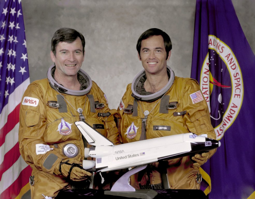 A file photo of STS-1 crew members Commander John Young (L) and Pilot Robert Crippen pose with a model of the Space Shuttle Columbia at Johnson Space Center in Houston May, 7, 1979. NASA/Handout via REUTERS/File Photo