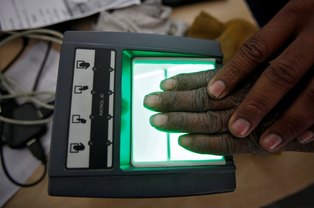 A file photo of a villager as he goes through the process of a fingerprint scanner for the Unique Identification (UID) database system at an enrolment centre at Merta district in the desert state of Rajasthan, India, February 22, 2013. REUTERS/Mansi Thapl