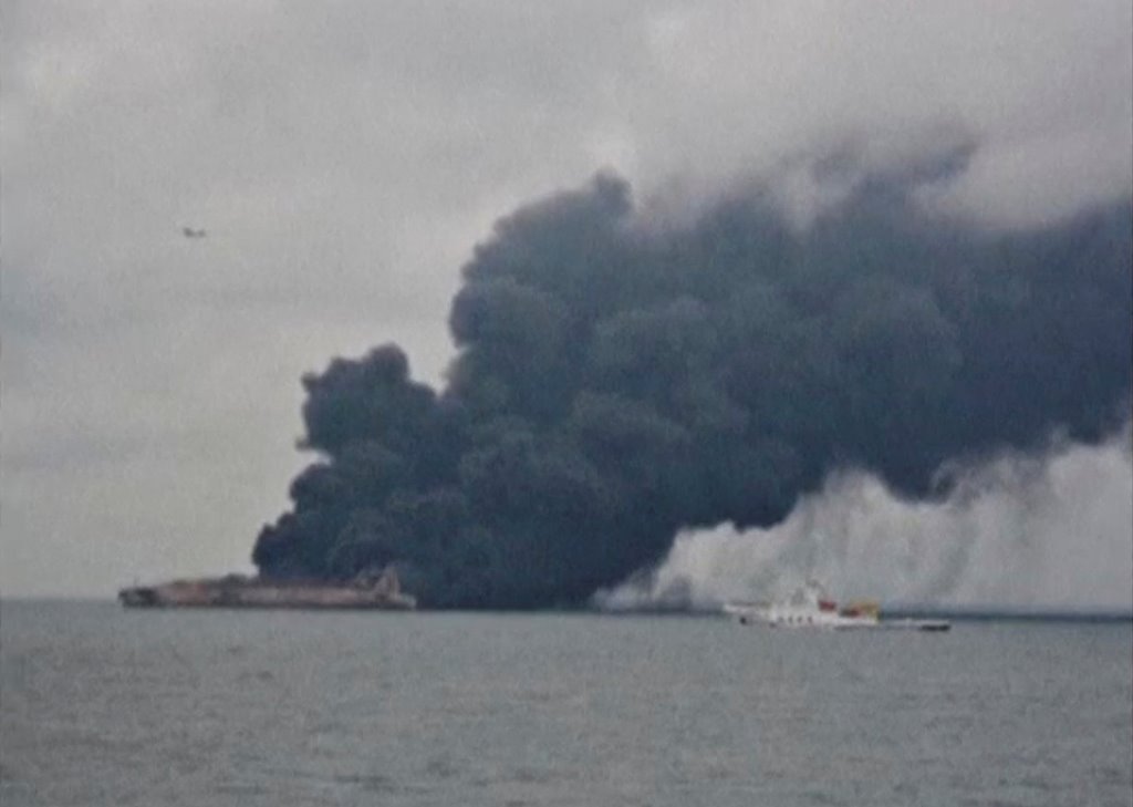 Smoke is seen from Panama-registered tanker SANCHI carrying Iranian oil after it collided with a Chinese freight ship in the East China Sea, in this still image taken from a January 7, 2018 video. China Central Television (CCTV) via REUTERS TV. 
