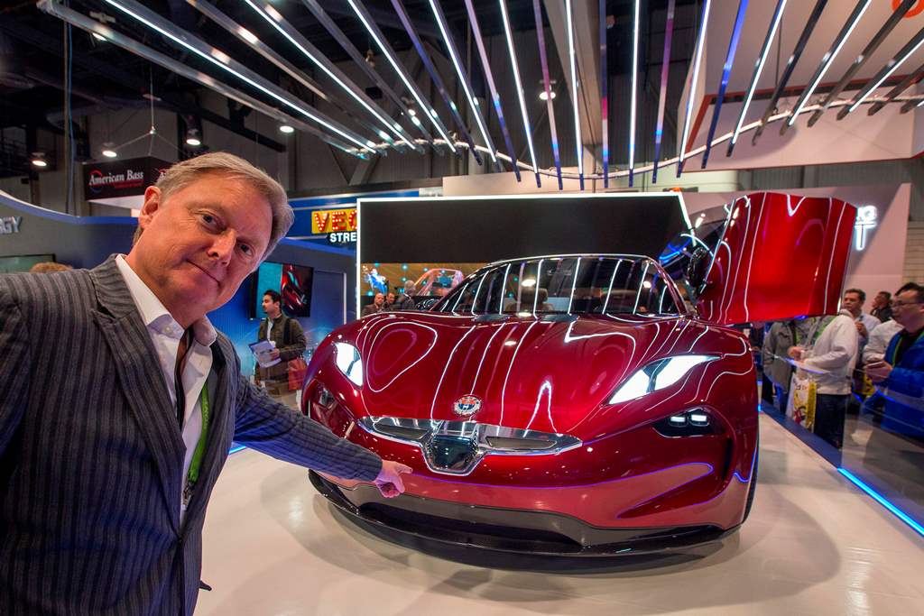 Henrik Fisker, founder, Chairman and CEO of Fisker Inc., speaks next to a Fisker EMotion all-electric vehicle that uses LiDAR technology at CES in Las Vegas, Nevada, January 9, 2018. / AFP / DAVID MCNEW