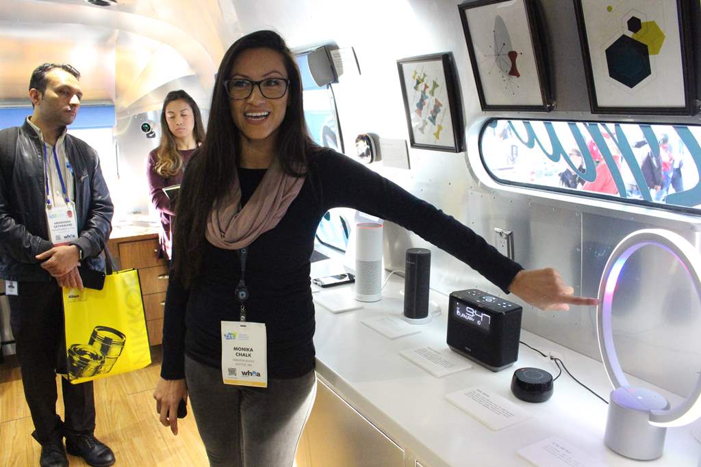 Monika Chalk of the Amazon Alexa team demonstrates an array of devices infused the company's artificial intelligence in a Roadshow trailer parked at the Consumer Electronics Show in Las Vegas, January 10, 2018. AFP / Glenn Chapman 