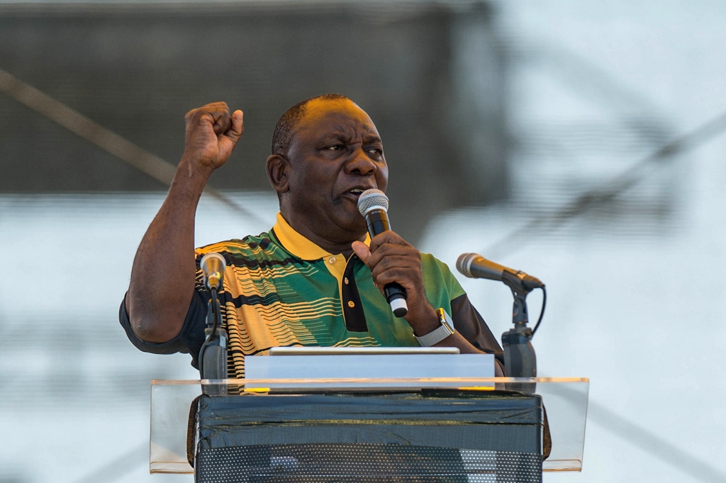 African National Congress President Cyril Ramaphosa addresses supporters at the ANC's 106th anniversary celebrations at Absa Stadium in East London, South Africa, during on January 13, 2018. AFP / MUJAHID SAFODIEN