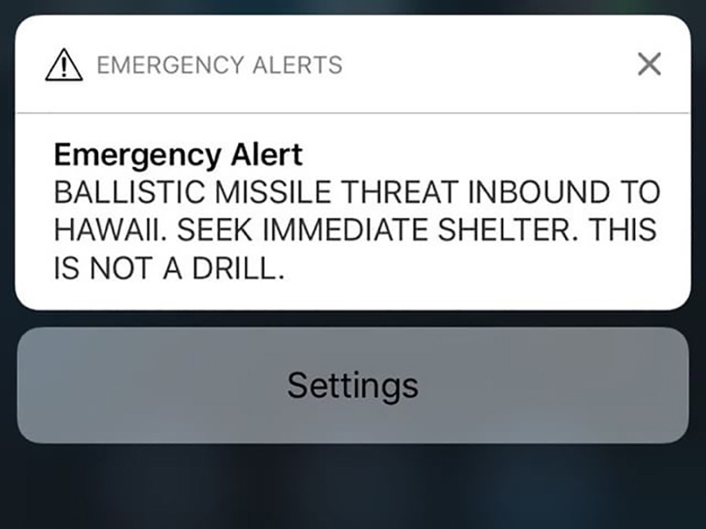 A screen shot take by Hawaiian citizen Alison Teal shows the screen of her mobile phone with an alert text message sent to all Hawaiian citizens on January 13, 2018. / AFP / Alison TEAL