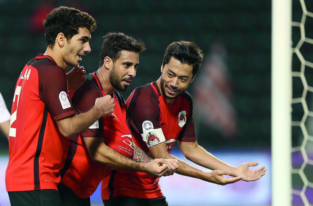 Al Rayyan’s Rodrigo Tabata (right) and team-mates celebrate a goal against Al Khor yesterday.  