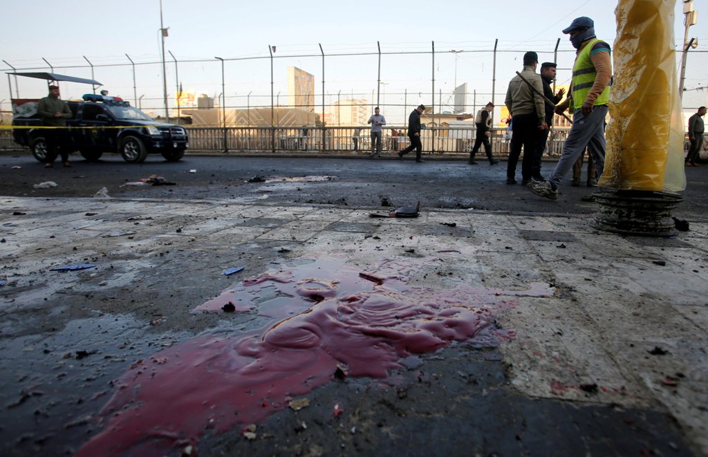 Iraqi security forces inspect the site of a bomb attack in Baghdad, Iraq January 15, 2018. REUTERS/Khalid al Mousily