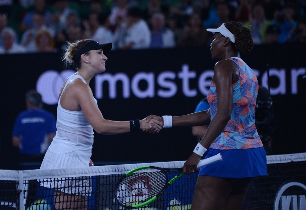 Belinda Bencic of Switzerland (L) shakes hand with Venus Williams of the United States on day one of the 2018 Australian Open at Melbourne Park on January 15, 2018 in Melbourne, Australia. ( Recep ?akar - Anadolu Agency )