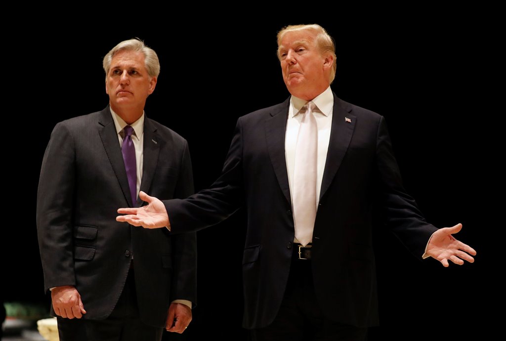 U.S. President Donald Trump speaks as he and House Majority Leader Kevin McCarthy arrive for dinner at Trump's golf club in West Palm Beach, Florida, U.S., January 14, 2018. REUTERS/Kevin Lamarque
