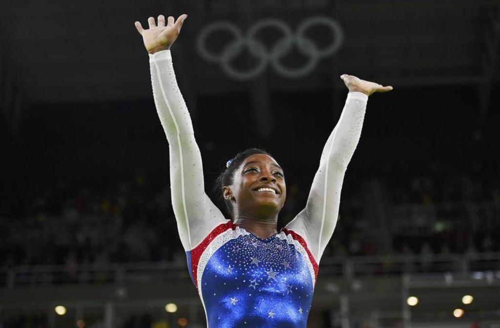 File photo of Simone Biles of USA celebrates winning gold in the women's gymnastics individual all-around final. REUTERS/Dylan Martinez