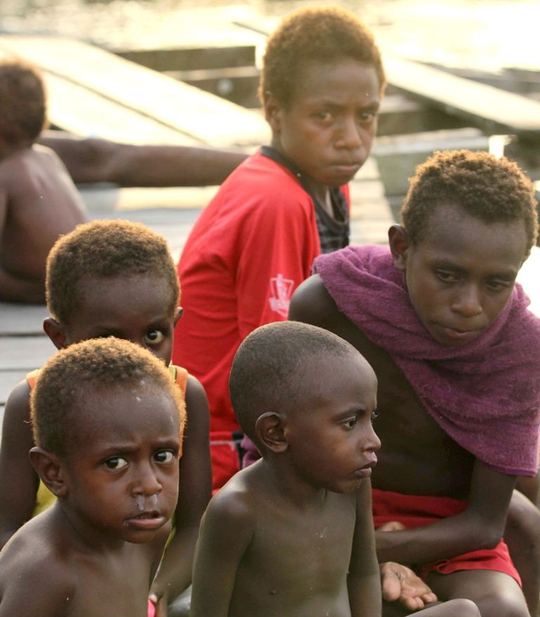 File photo of a group of Papuan children at their village home in Asmat, in a regency in Indonesia's easternmost province Papua, October 11, 2016. / AFP / Yamin MUHAMMAD