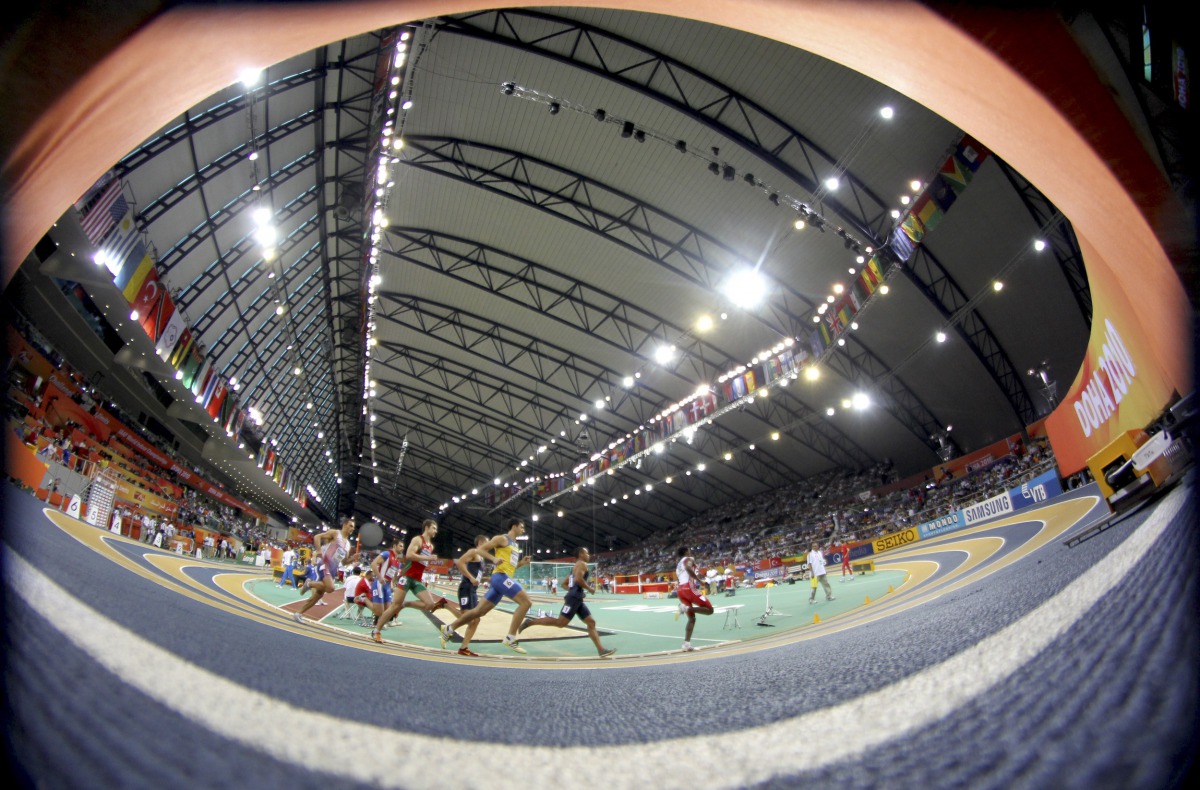 Runners compete in the men’s heptathlon 1000 meters race at the 2010 IAAF World Indoor Athletics Championships at the Aspire Dome in this file picture.