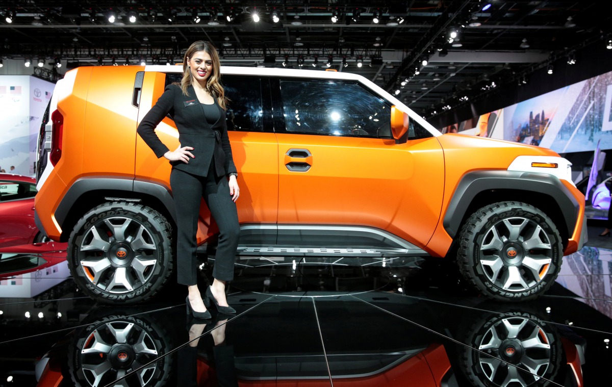 Product Specialist Ally Kay poses next to a Toyota 4X concept vehicle during Press Days of the North American International Auto Show at Cobo Center in Detroit, Michigan, U.S., January 16, 2018. Reuters/Rebecca Cook