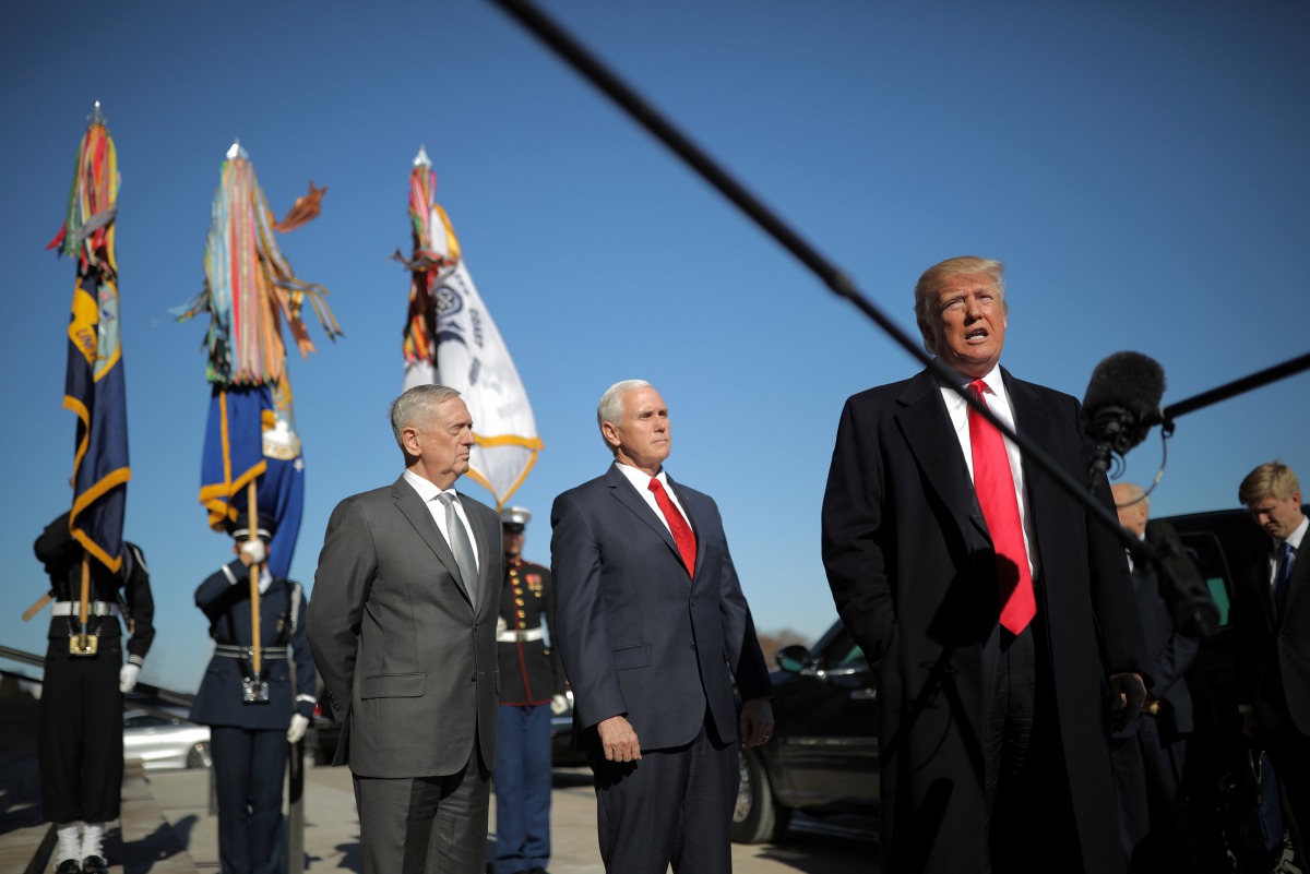 U.S. President Donald Trump speaks to reporters as he arrives for a meeting at the Pentagon, accompanied by U.S. Defense Secretary Jim Mattis and Vice President Mike Pence in Arlington, Virginia, U.S., January 18, 2018. Reuters/Carlos Barria
