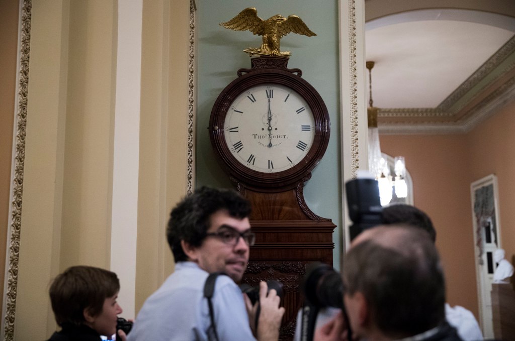 The Ohio Clock strikes 12 o'clock midnight as Senate Majority Leader Mitch McConnell tries to broker a deal with Democrats on the continuing resolution in the US Capitol in Washington, DC, USA, 19 January 2018. EPA/SHAWN THEW
