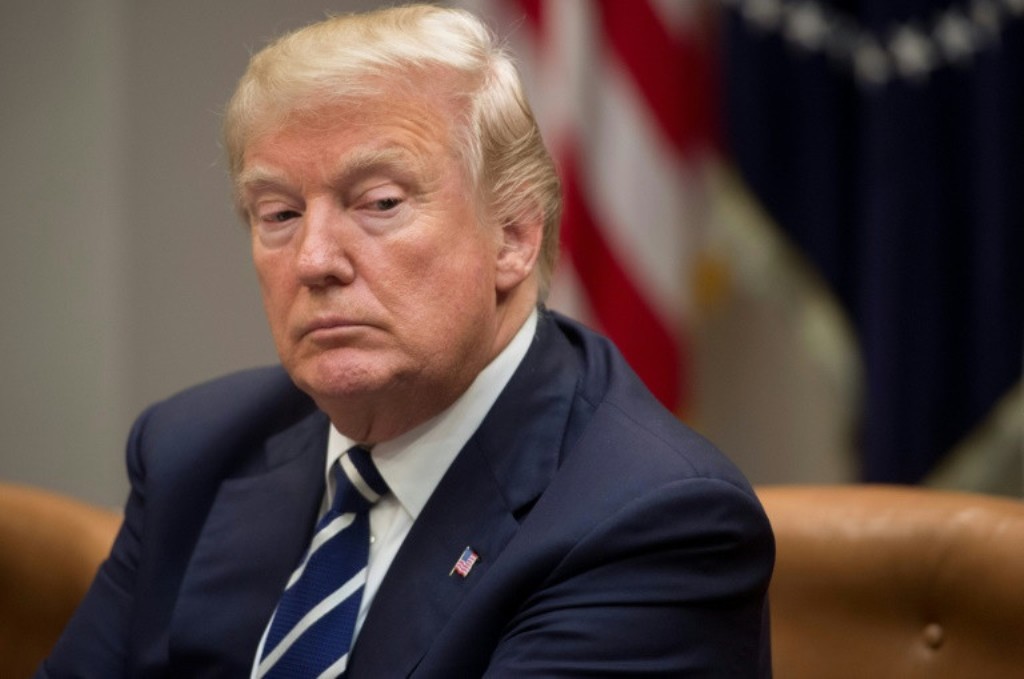 US President Donald Trump, shown in this January 11, 2018 file photo, blames Democrats for the budget standoff and resulting government shutdown. AFP/File / SAUL LOEB