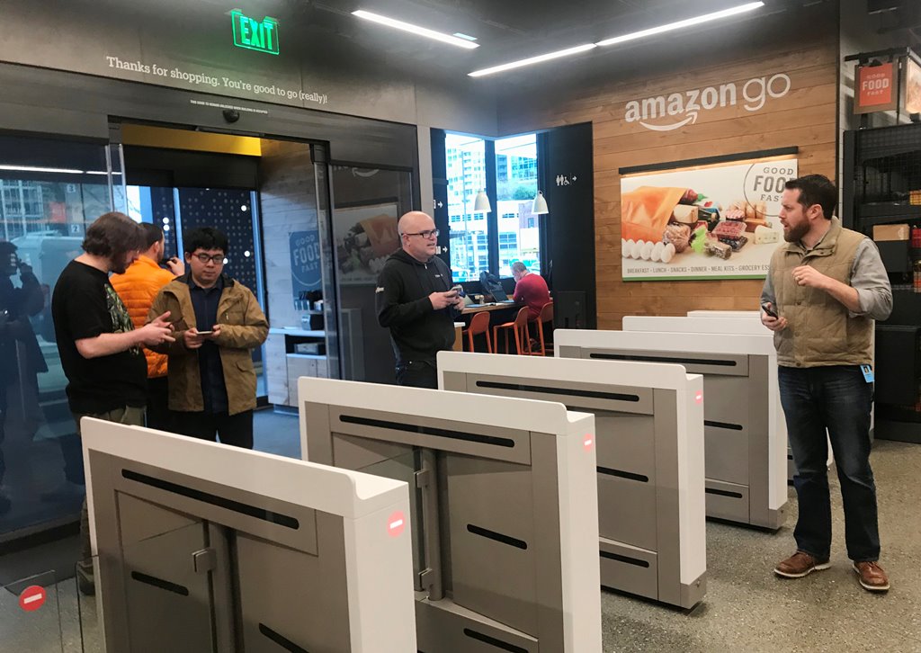 Shoppers enter the Amazon Go store located in Amazon's 