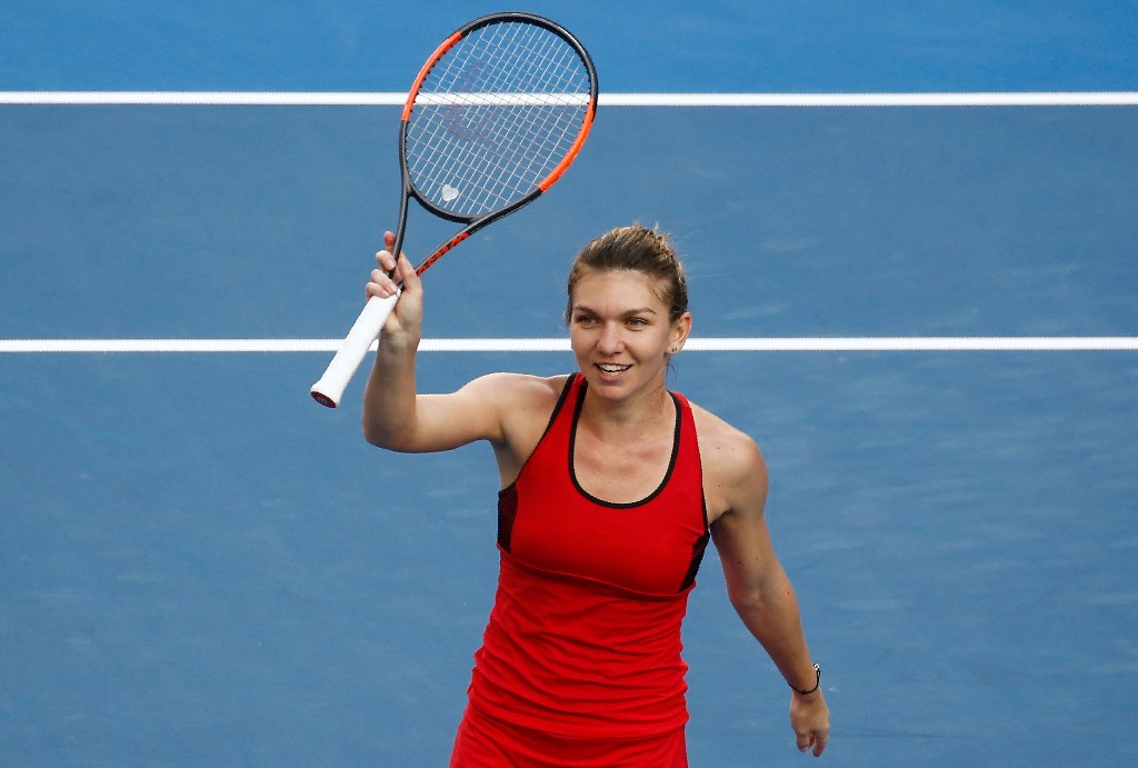 Simona Halep of Romania celebrates winning against Naomi Osaka of Japan. REUTERS/Thomas Peter