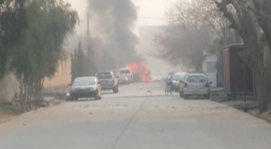 Smoke rises at the site of a blast near the office of the Save the Children aid agency in Jalalabad, Afghanistan, in this still image taken from Reuters TV footage, January 24, 2018. REUTERS/ReutersTV